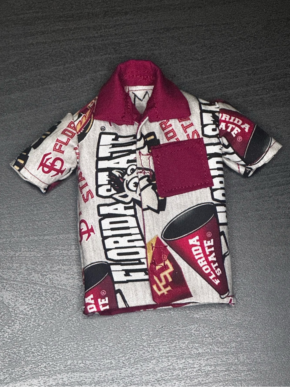 Handcrafted Florida State University themed doll shirt lined in maroon